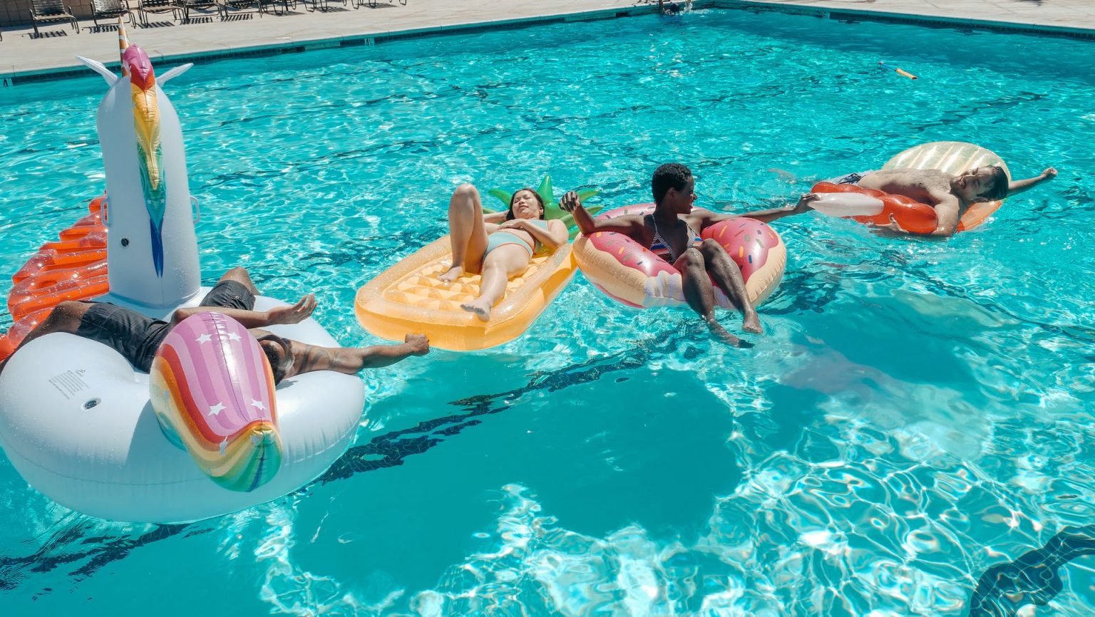 People Swimming In A Pool