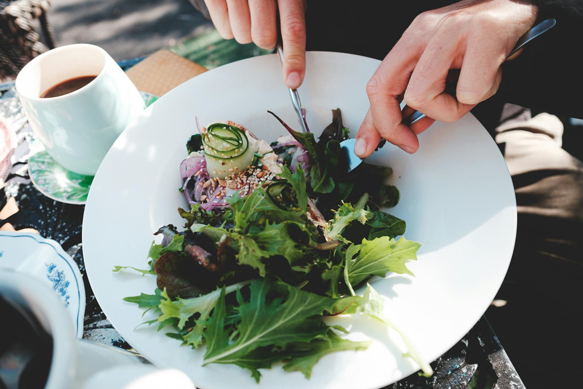 Person enjoying vegetarian food