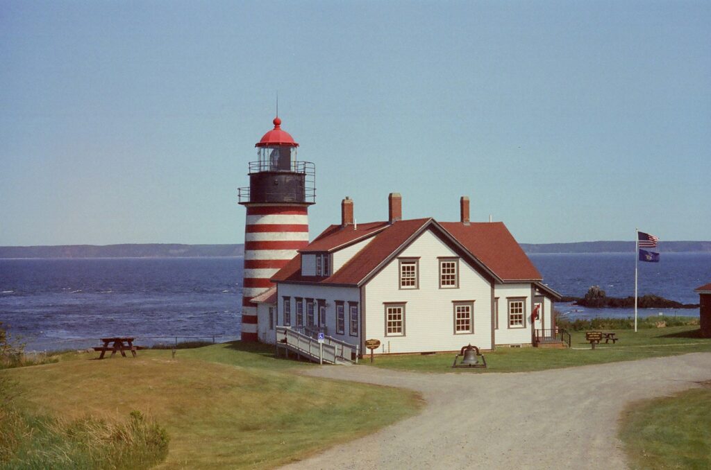 Red And White Striped Lighthouse In Lubec, Maine - An Underrated Beach Destination In USA